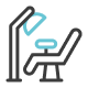 Icon of a dental chair with a lamp, illustrating a dentist's office setup.