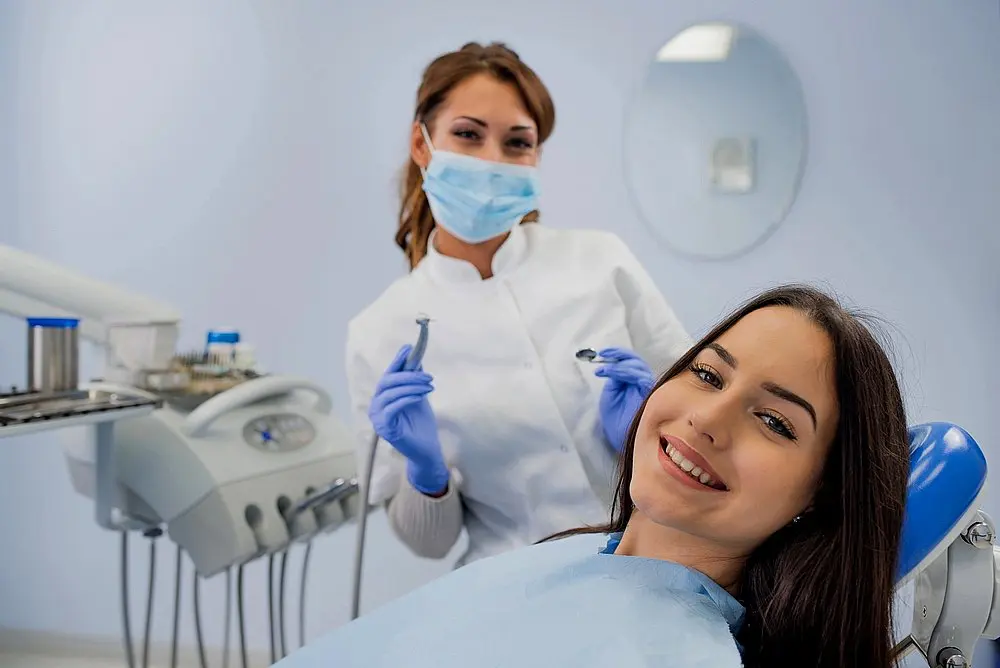 young woman patient examined by an orthodontist after being explained about How to Fix Overbite in New York, NY
